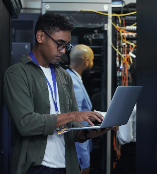 Technician setting up network cables in a modern office in Saskatoon