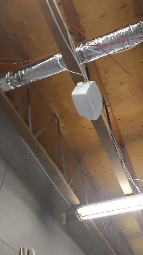 Wi-Fi access point mounted on an open ceiling