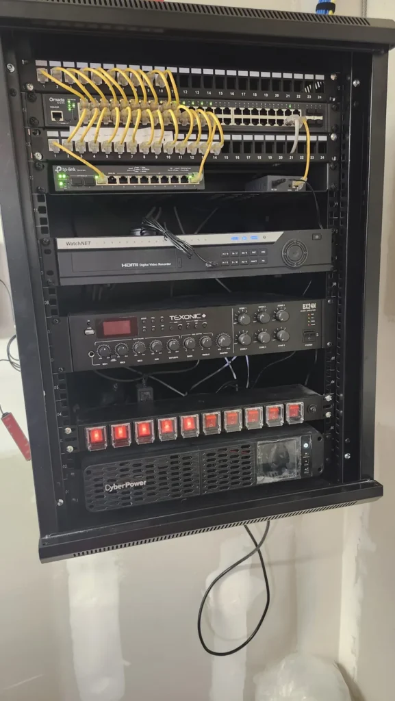 Finished network rack with switch, recorder, amplifier and UPS