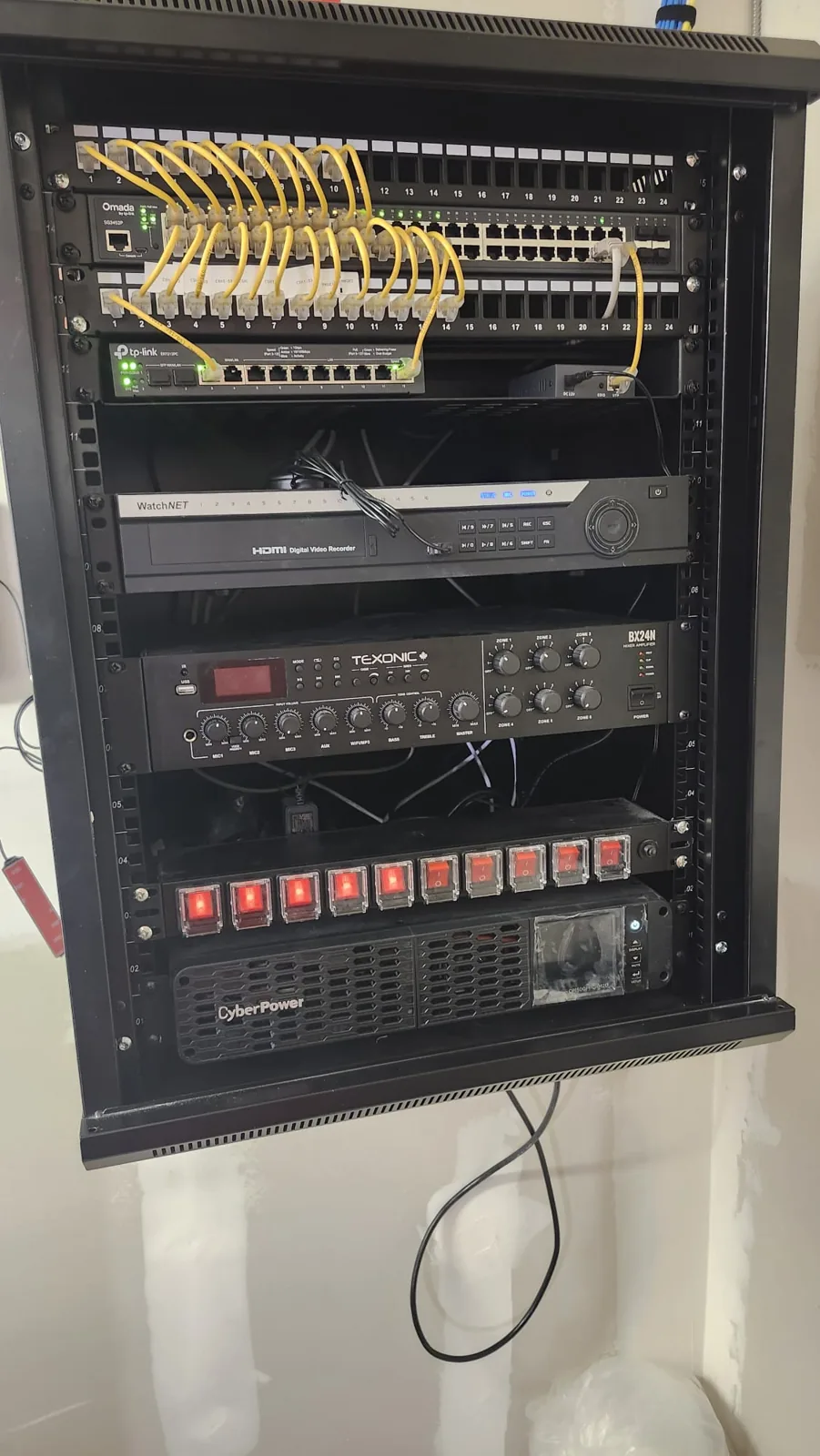 Finished network rack with switch, recorder, amplifier and UPS