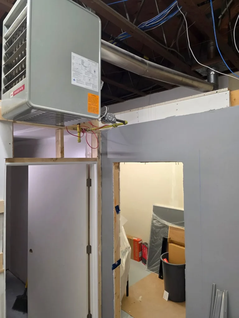 Low-voltage cabling routed overhead during a commercial fit-out